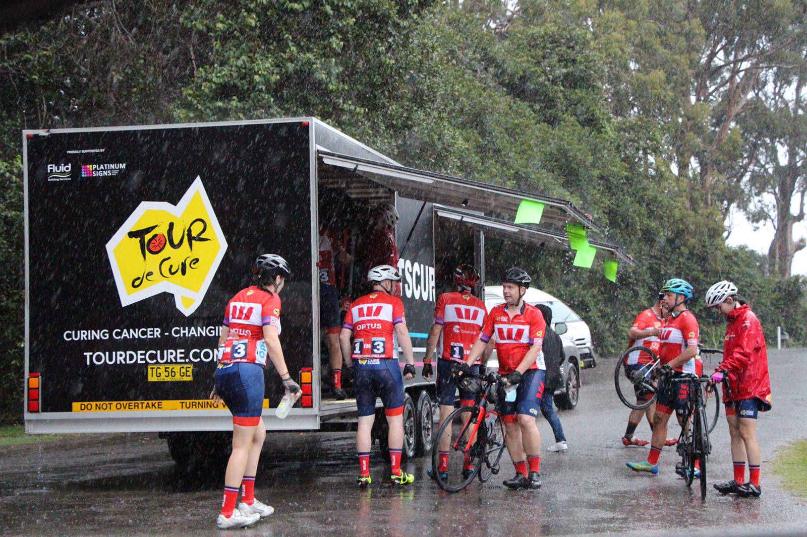 Loading our bikes in the rain